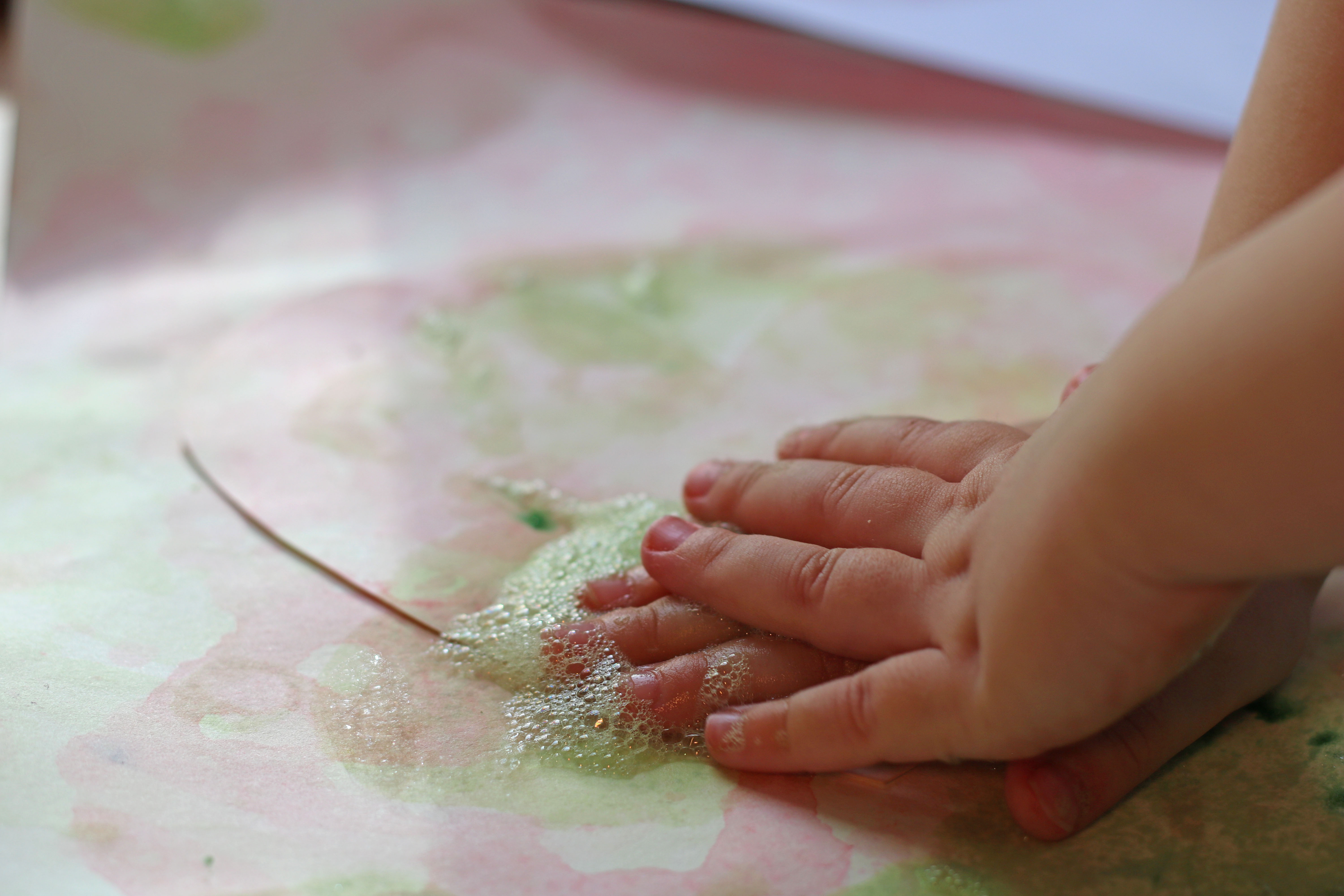 Picture of a toddler blowing bubbles